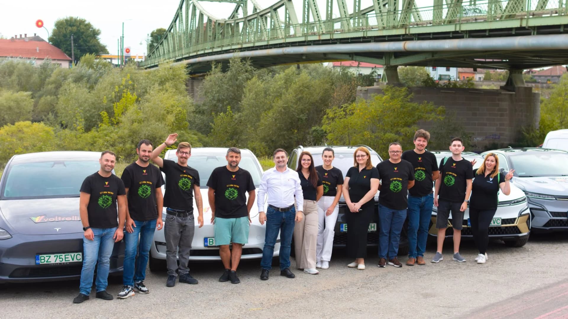 The Voltrelli team together in front of electric vehicles.